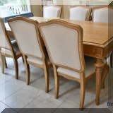 F29. Universal Furniture oak dining table with additional leaf and 6 chairs. Table: 31”h x 78”w x 39”d 